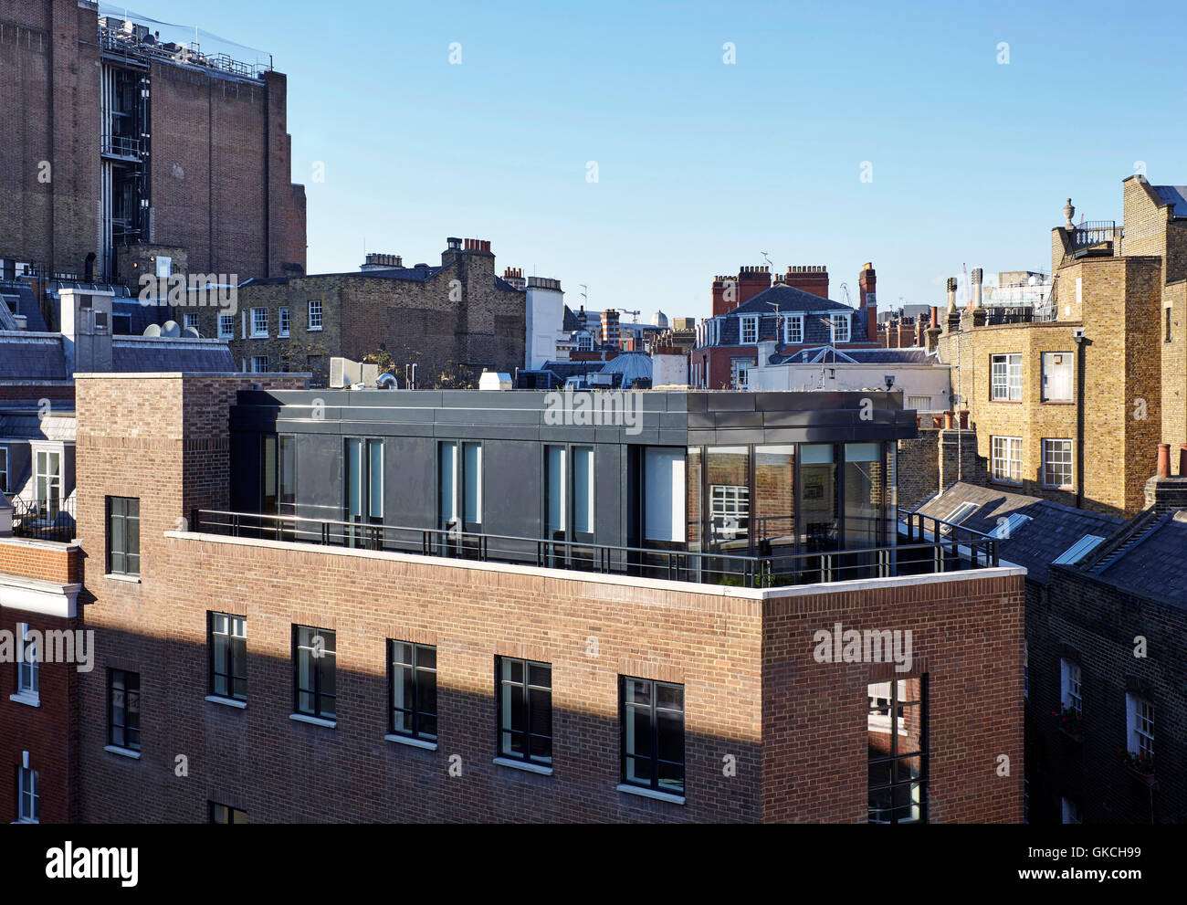 View looking over Mayfair with Brooks Mews top floor addition in context. 54 Brooks Mews, London, United Kingdom. Architect: Stiff + Trevillion Architects, 2016. Stock Photo