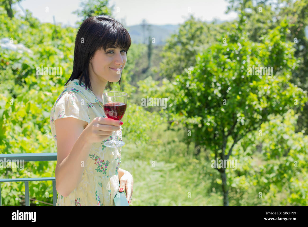 woman drinking red wine in a vineyard, outdoor Stock Photo - Alamy
