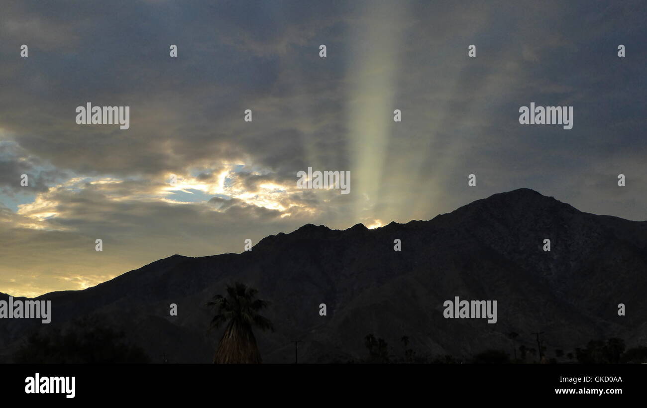 Clouds and sun beams over the San Isidro mountain range Stock Photo