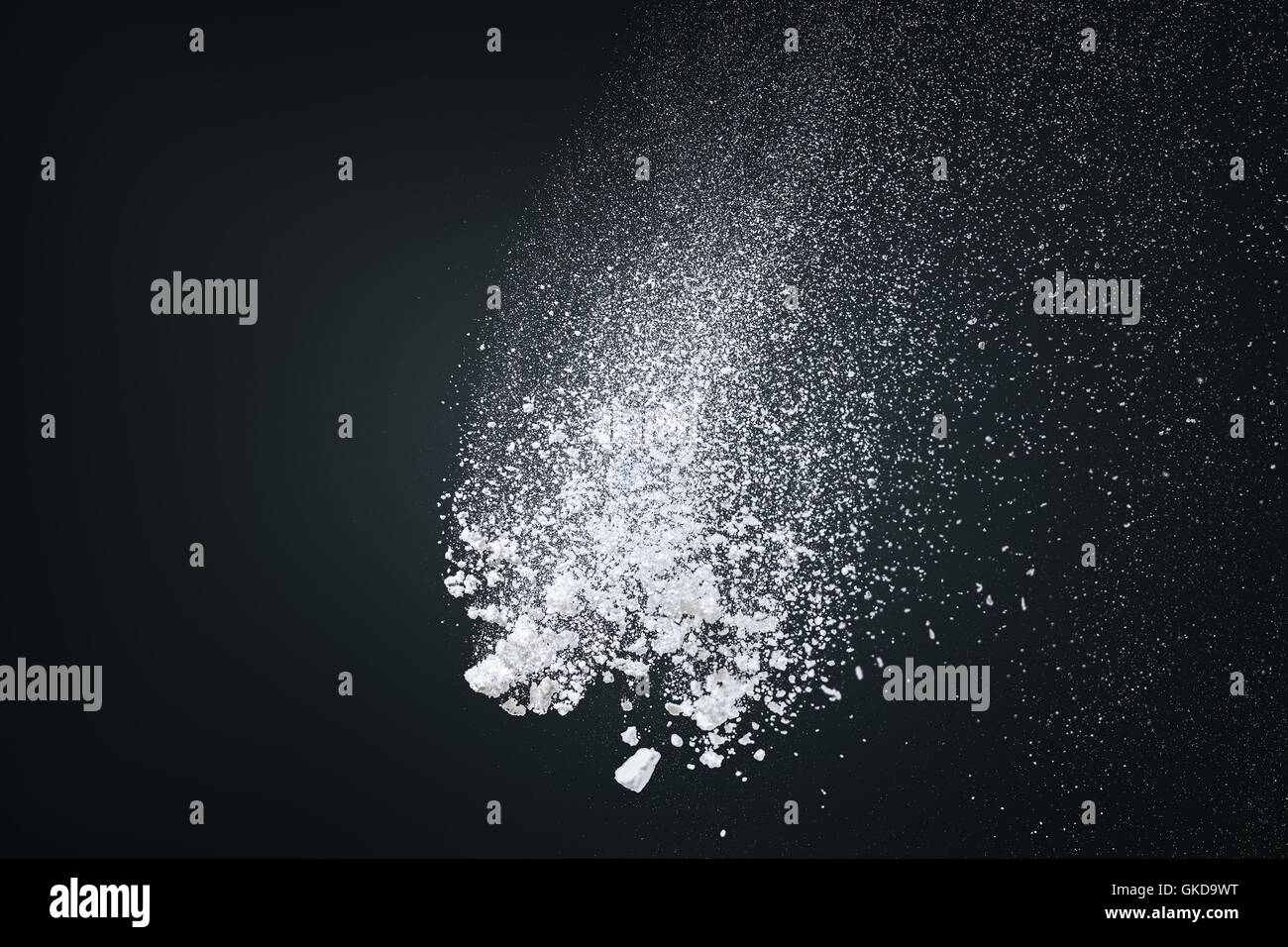 Abstract design of powder cloud texture explode over dark background Stock Photo