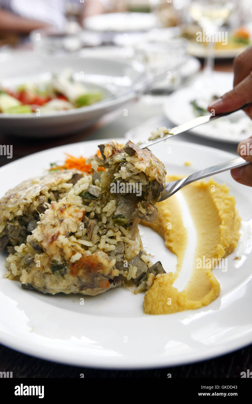 Restaurant Fillet in Drama, Greece. Tzigerosarmas (goat liver, rice, onion & dill) with fava Stock Photo