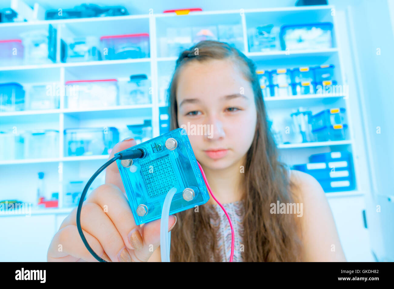 Student teen girl with experiment PEM proton exchange membrane reversible fuel-cell Stock Photo