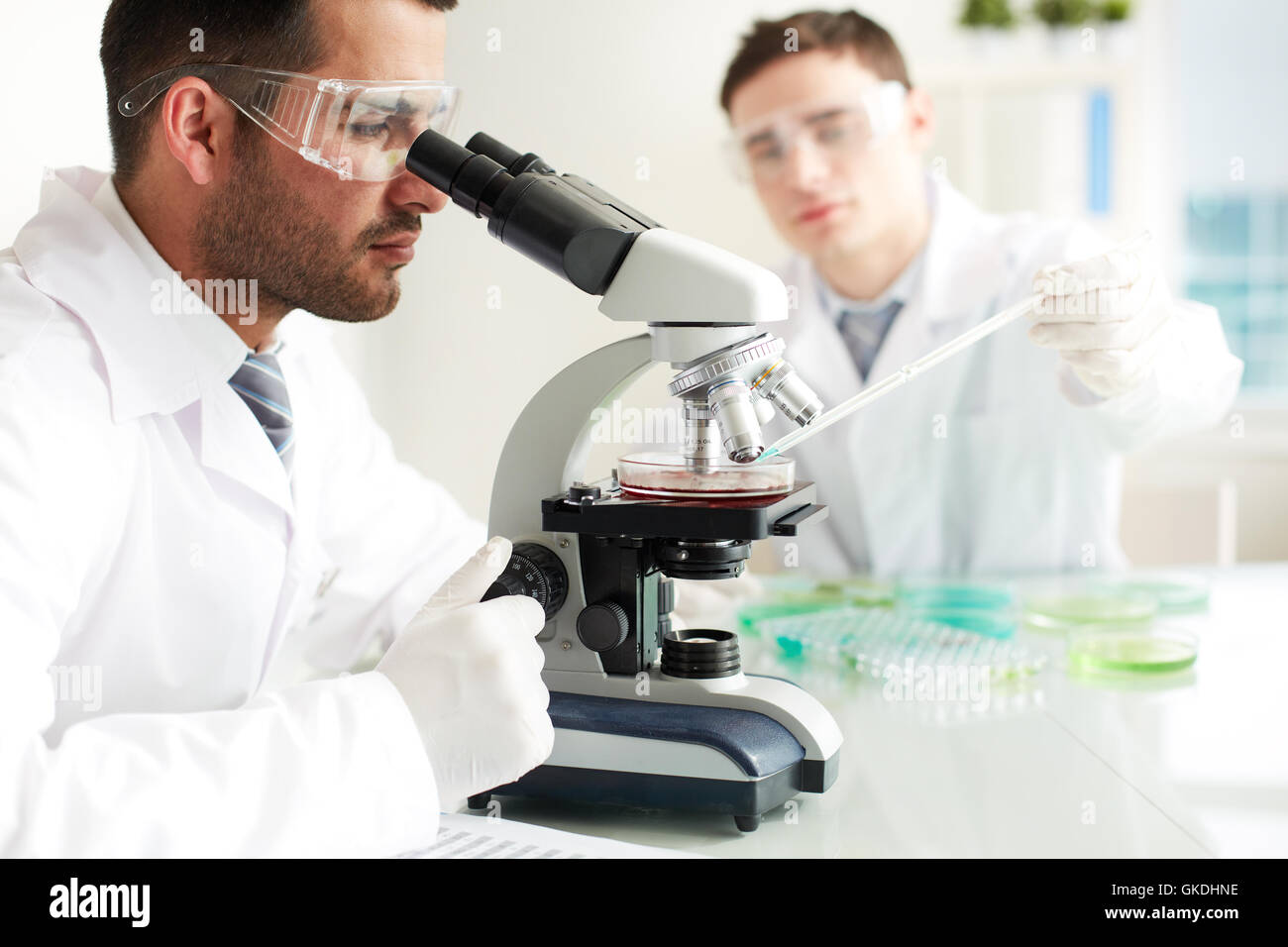 Investigating Humans Uniform glasses investigation serious hi-res stock photography and ...