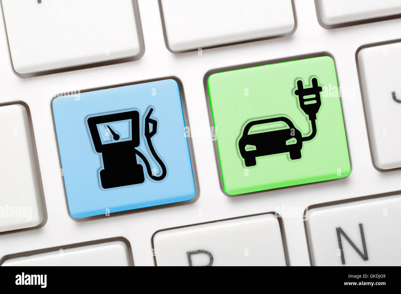 Gas and electric car key on keyboard Stock Photo