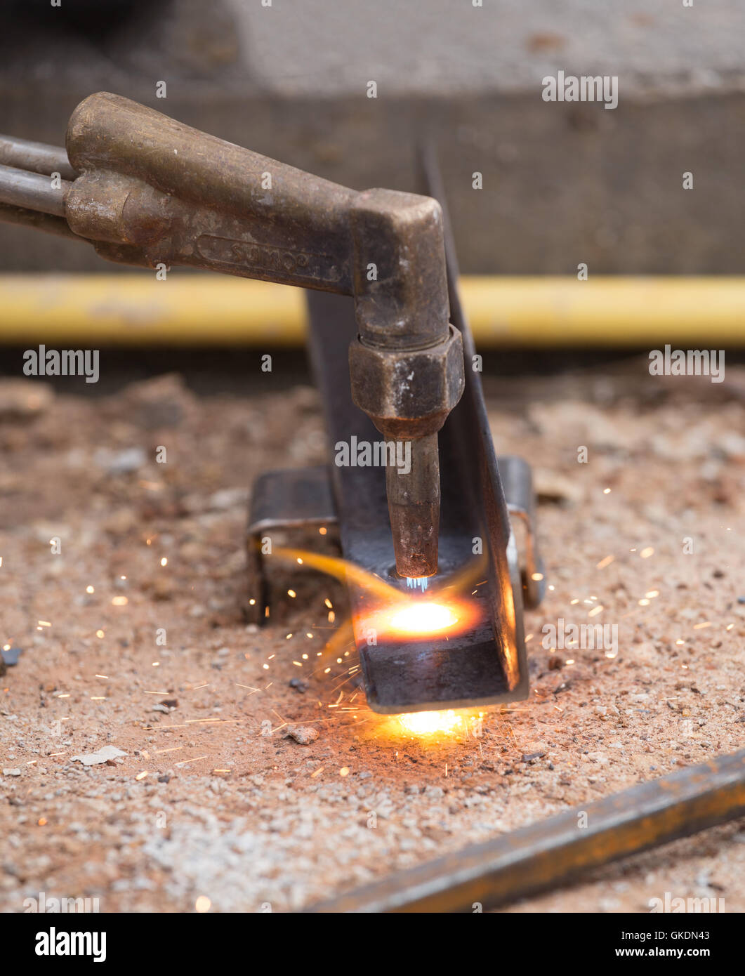 worker drilling steel plate at construction site Stock Photo Alamy