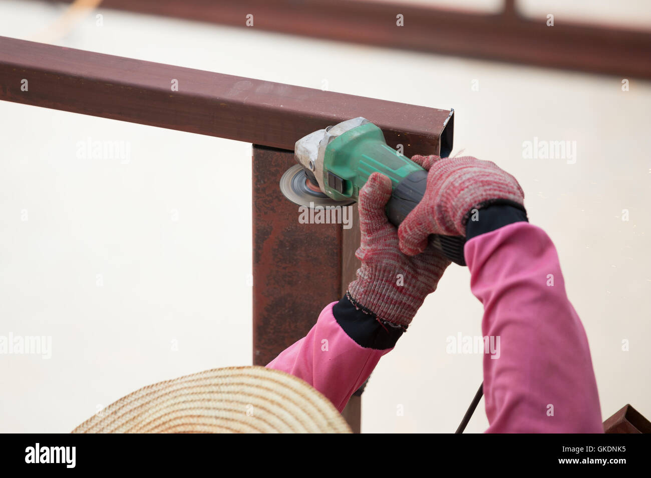 worker using an angle grinder to grinding metal Stock Photo - Alamy