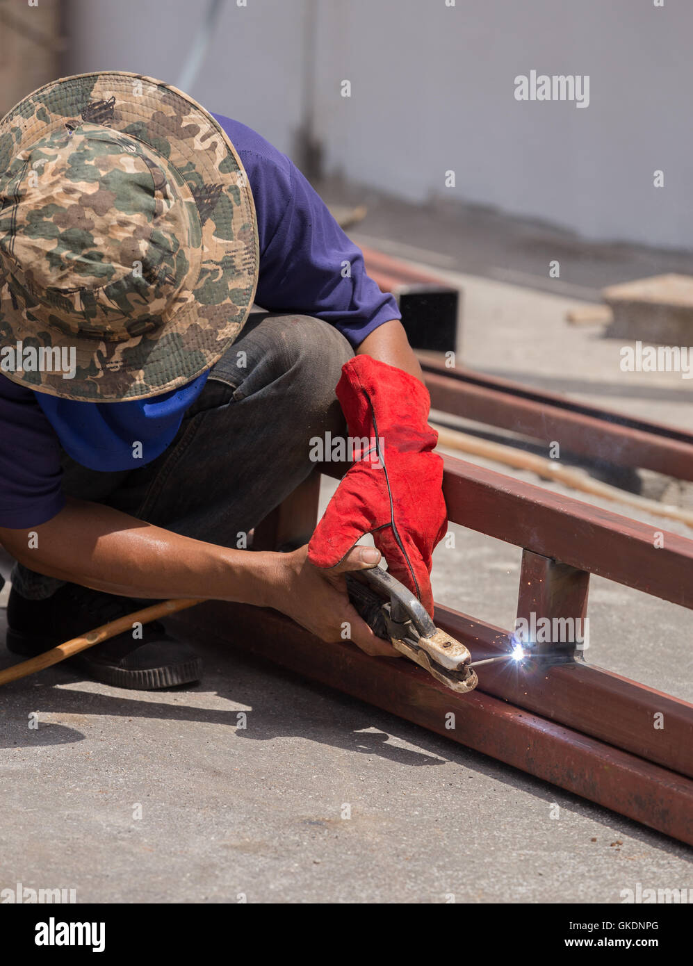 Welder working a welding metal. Not wearing glove Stock Photo