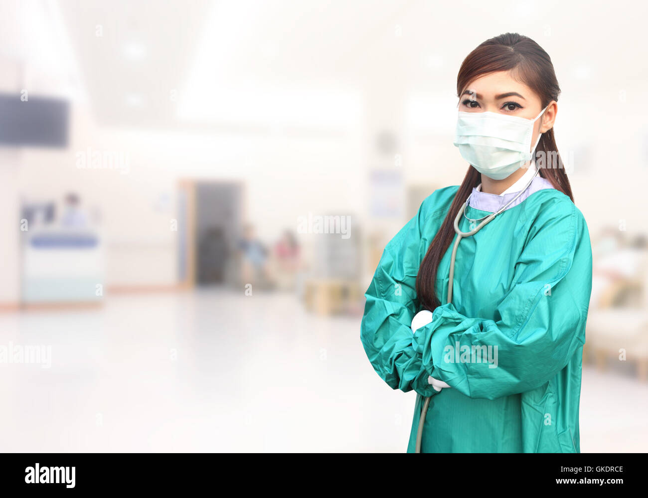 female doctor wearing a green scrubs and stethoscope in hospital ...