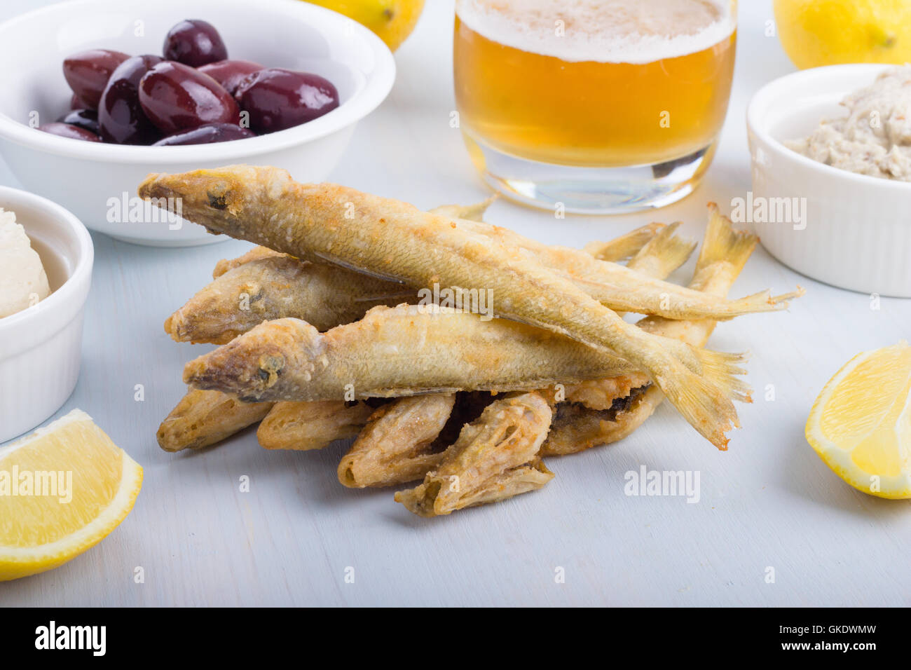 Fried ladyfish with lemon, beer, olives and hoummous and mutabel Stock
