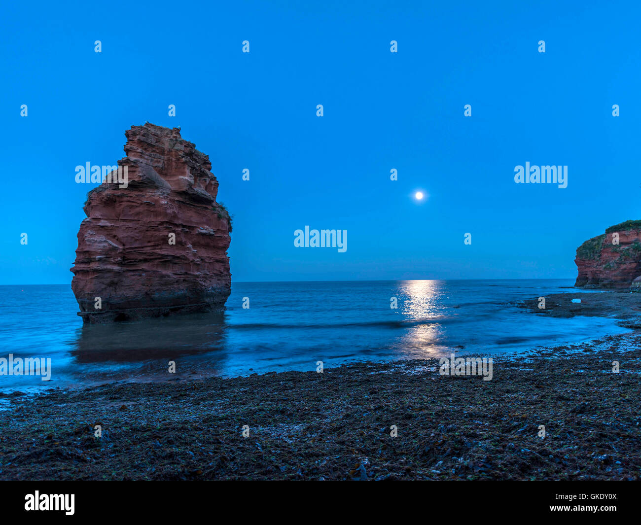 Jurassic coast rock formation by moonlight at Ladram Bay Cove, Devon Stock Photo