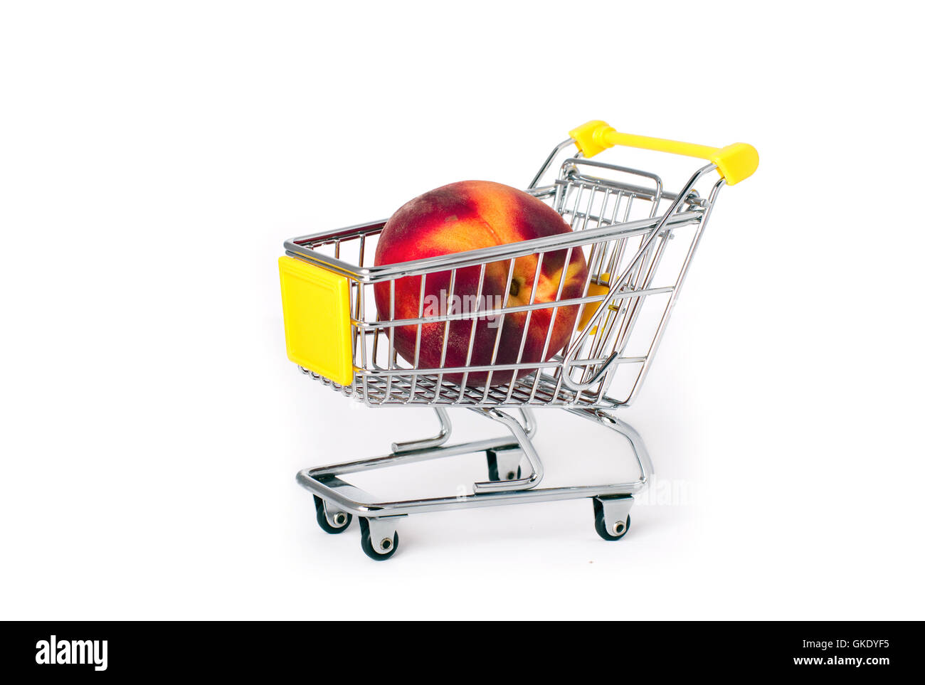 Shopping cart with a large peach Stock Photo