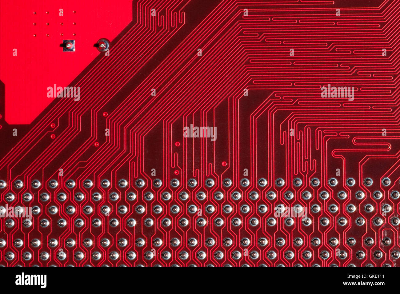 Closeup of computer circuit board in red Stock Photo - Alamy