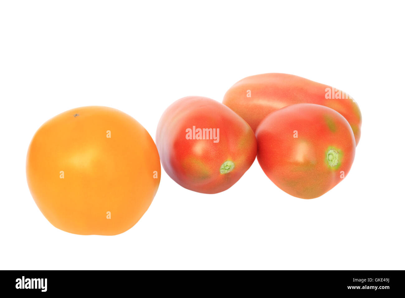 one yellow and three red tomato Stock Photo Alamy