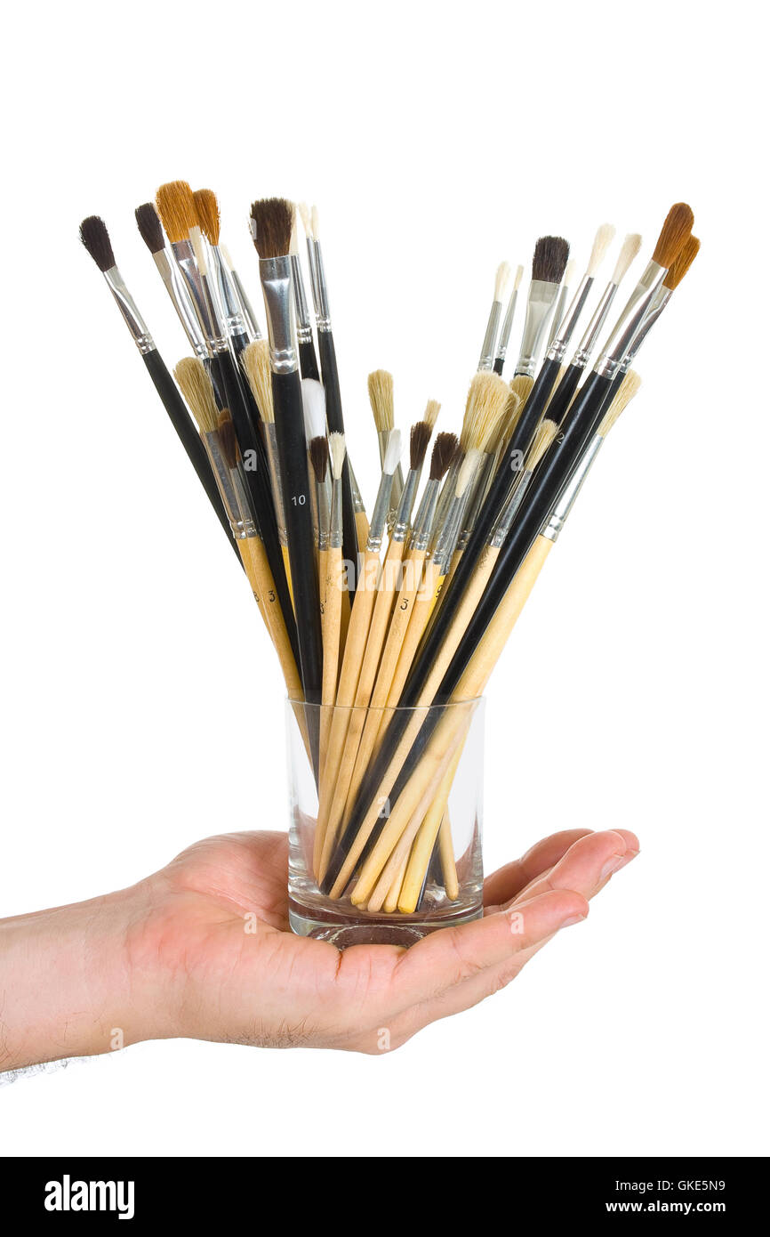 Brushes in hand Stock Photo Alamy