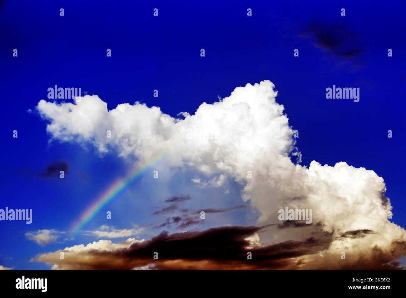 Rainbow blue sky background picture Stock Photo - Alamy