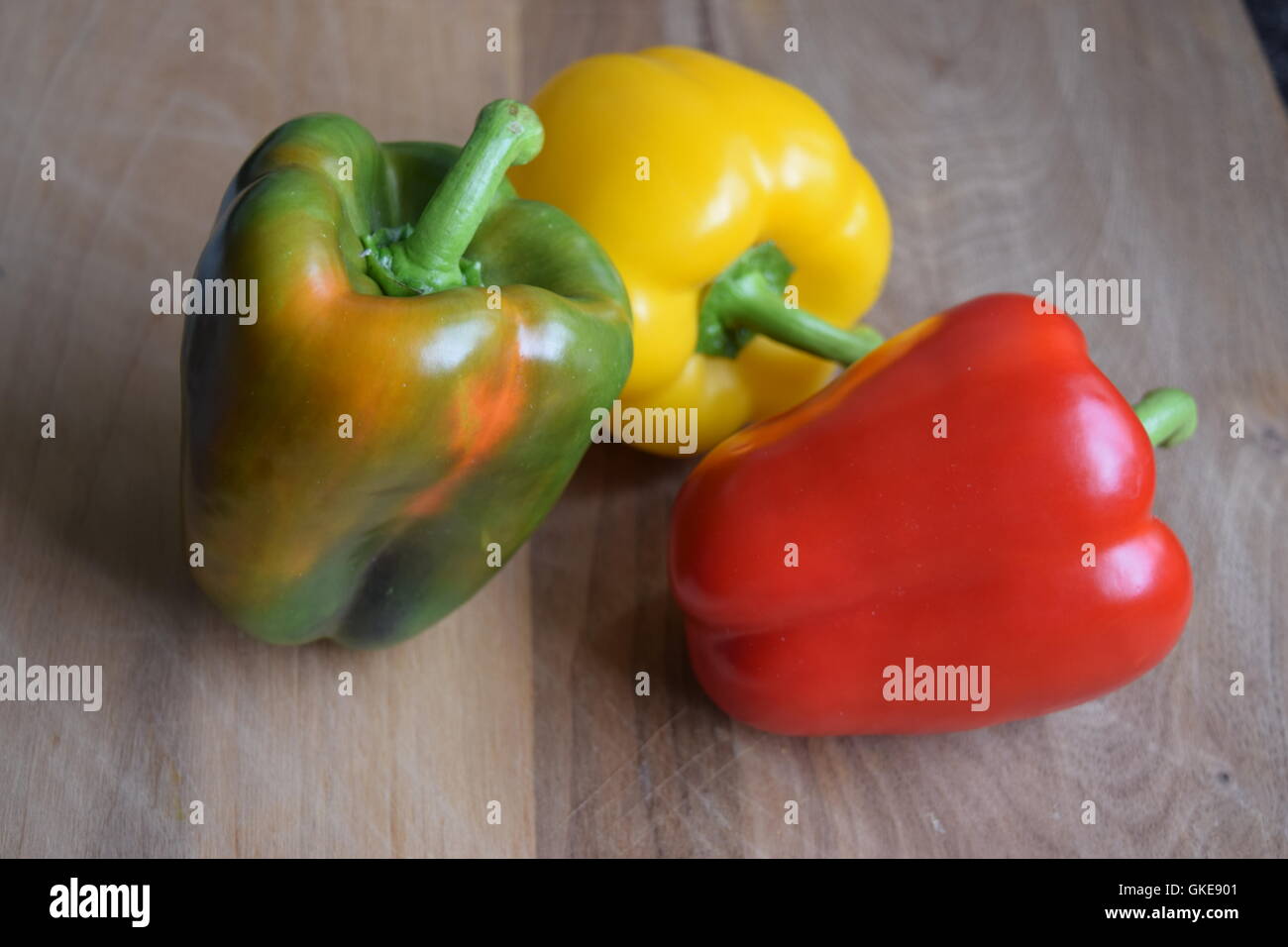 Different Colours of Peppers on a Wooden Board Stock Photo - Alamy