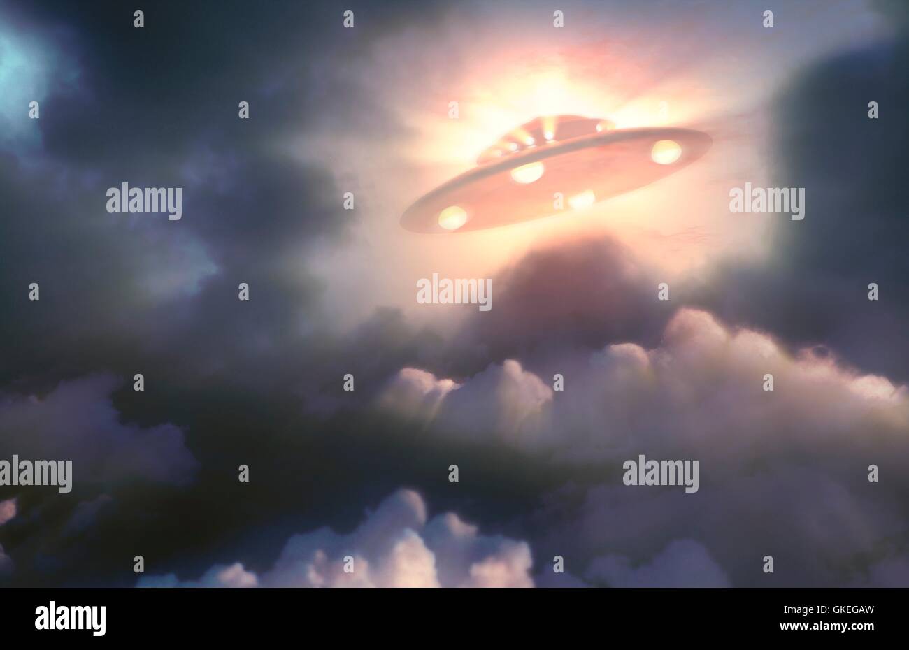 Artwork of a UFO or unidentified flying object, seen above a background of clouds. Stock Photo
