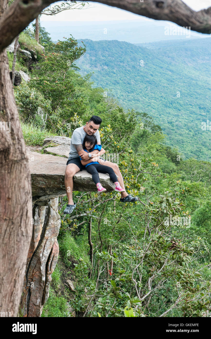 Sitting on the edge of Pha Ham Hod, which translates to 'shrunken balls cliff!' Sai Thong National Park, Chaiyaphum, Thailand Stock Photo