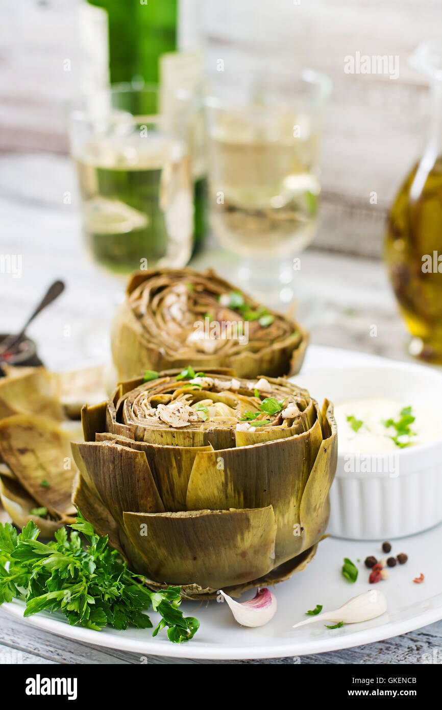 Baked artichokes cooked with garlic sauce, mustard and parsley Stock