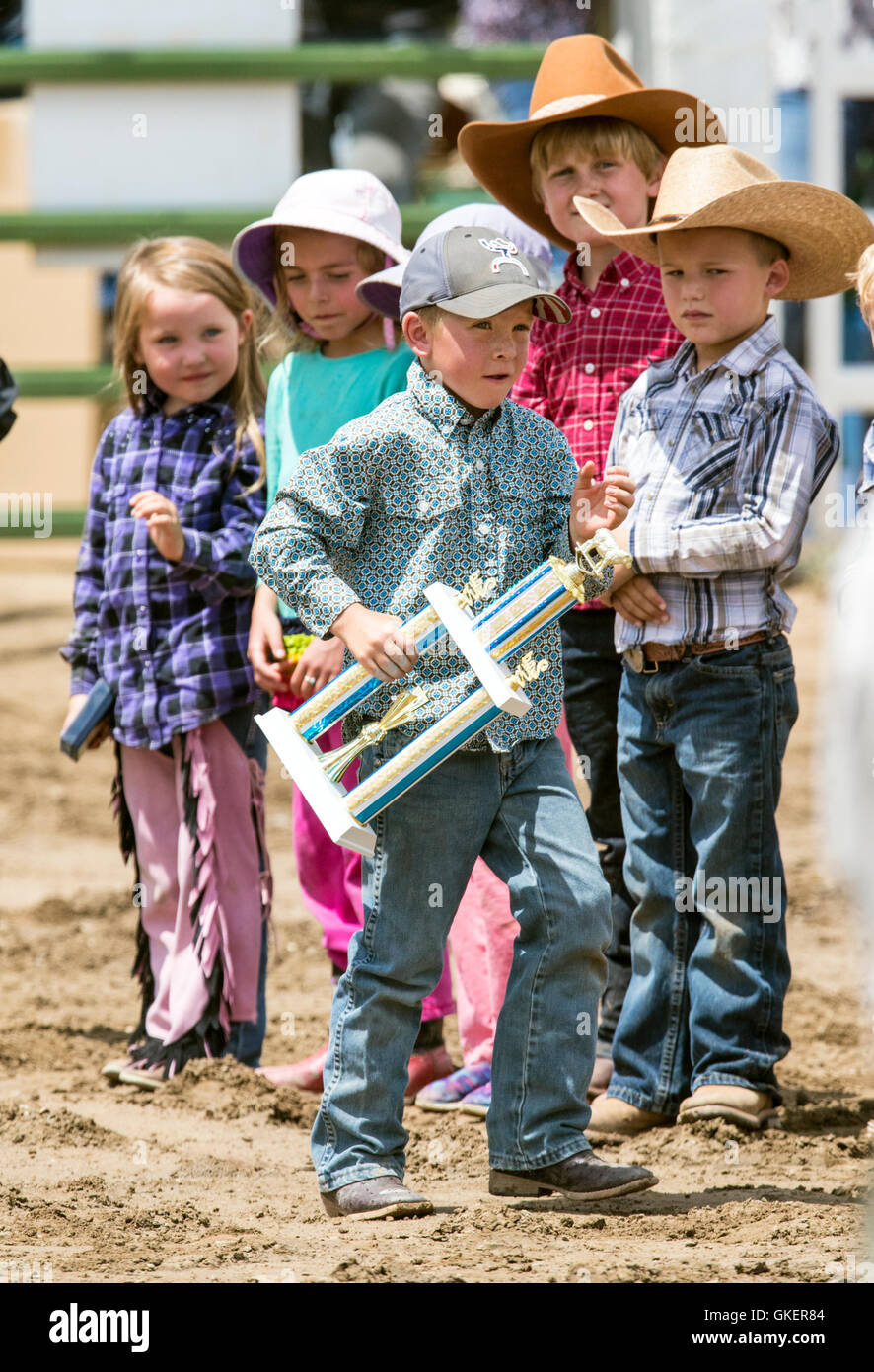 Winning Mutton Bustin' children line up for awards; Chaffee County Fair & Rodeo, Salida, Colorado, USA Stock Photo