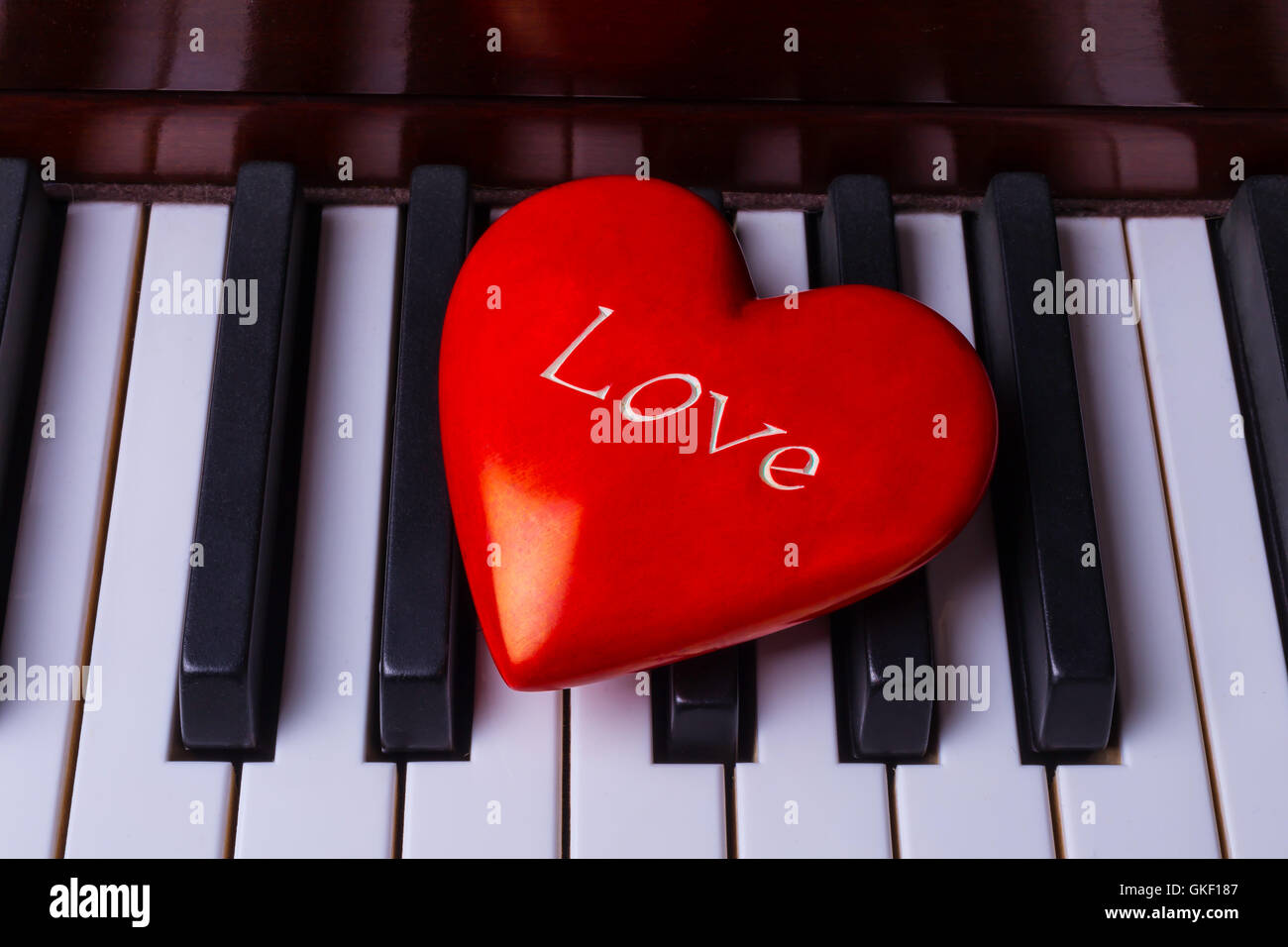 Bright Red Heart On Piano Keys Stock Photo
