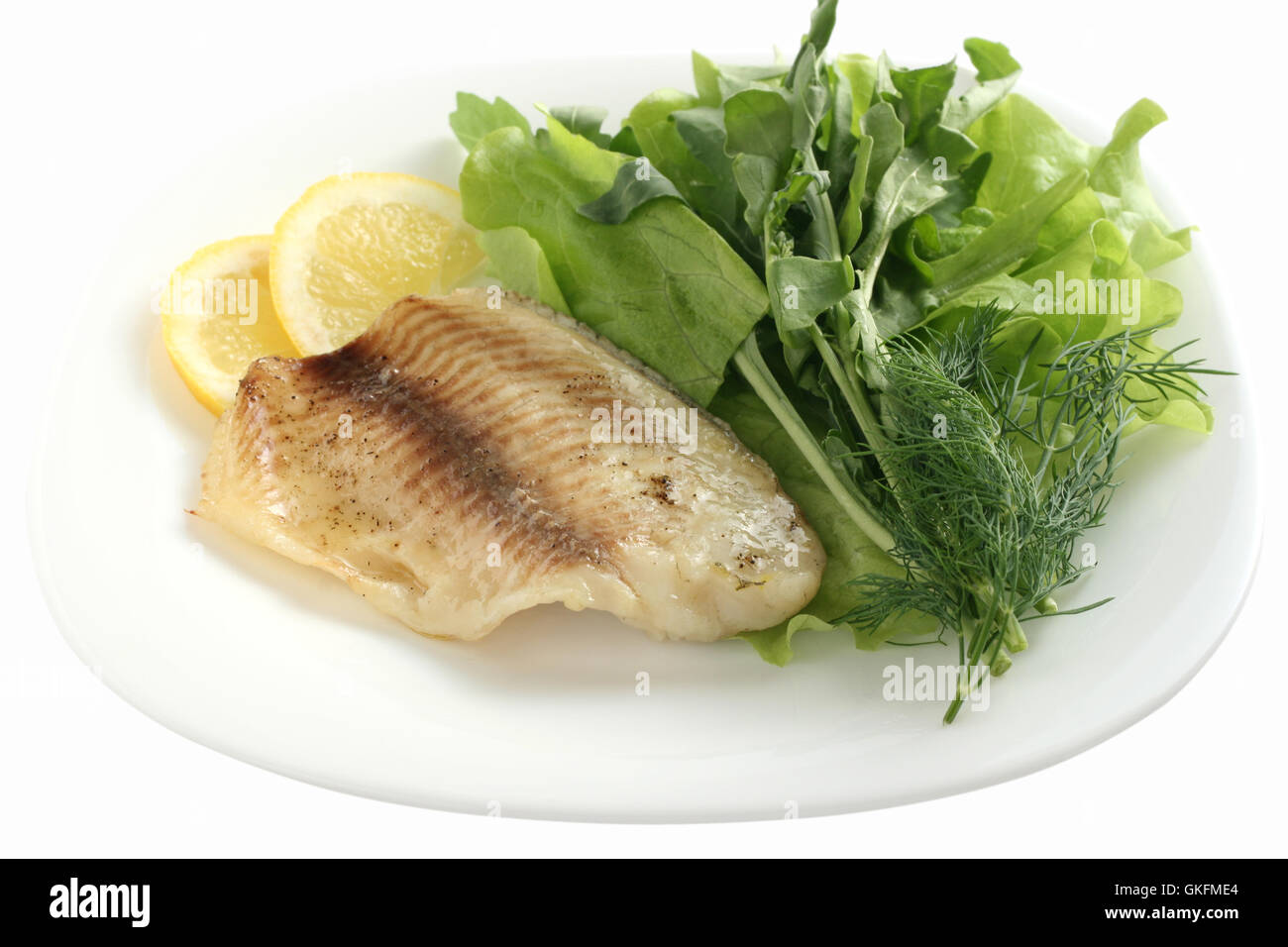 fried tilapia with salad Stock Photo Alamy