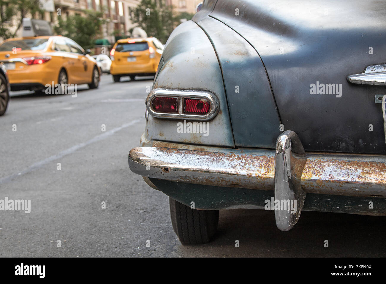 Rear view of an old vintage car in need of restoration. Stock Photo