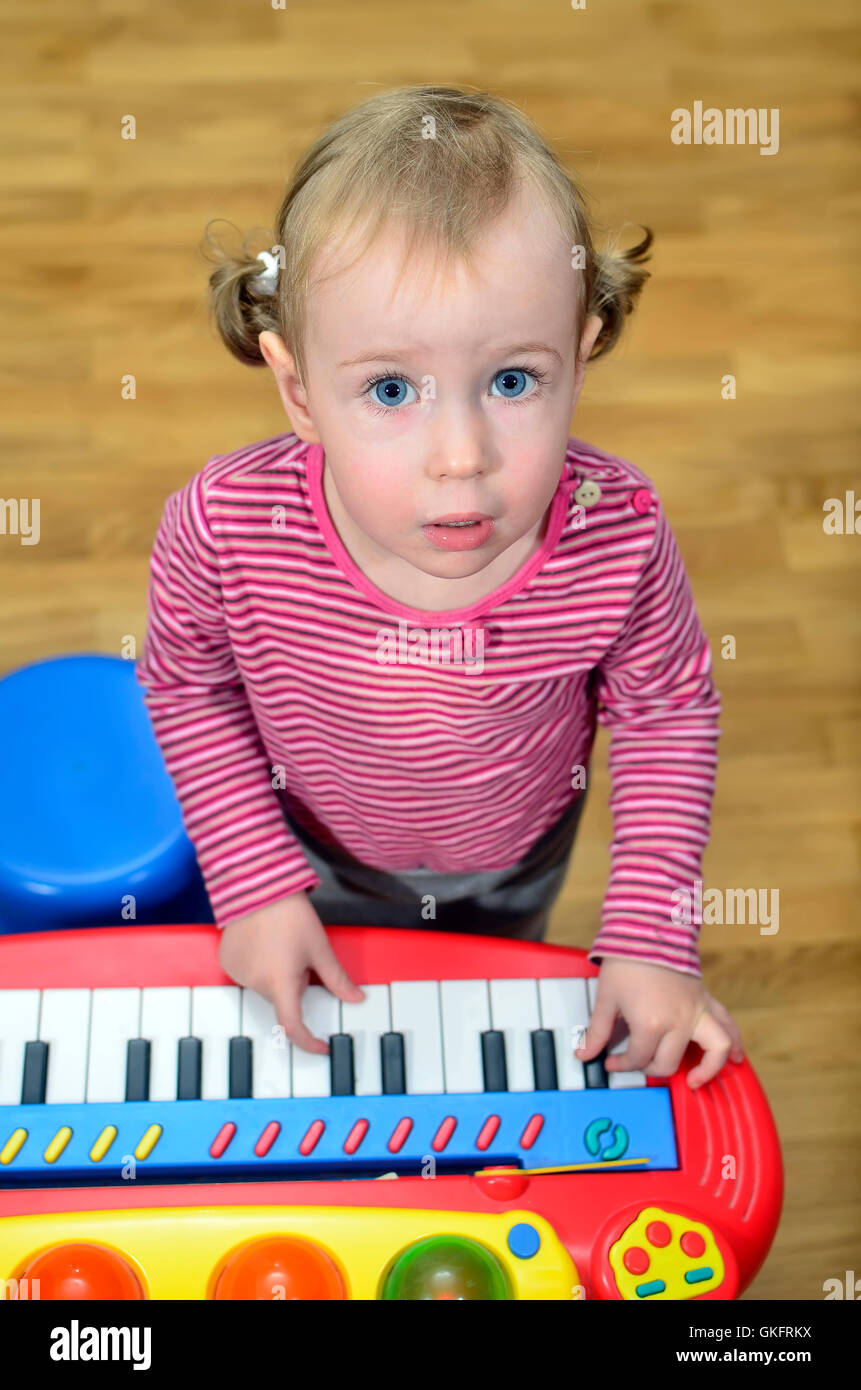 little girl playing the piano Stock Photo