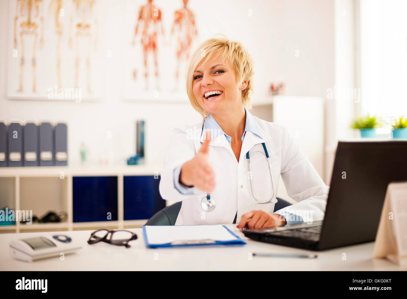 Attractive female doctor smiles hi-res stock photography and images - Alamy