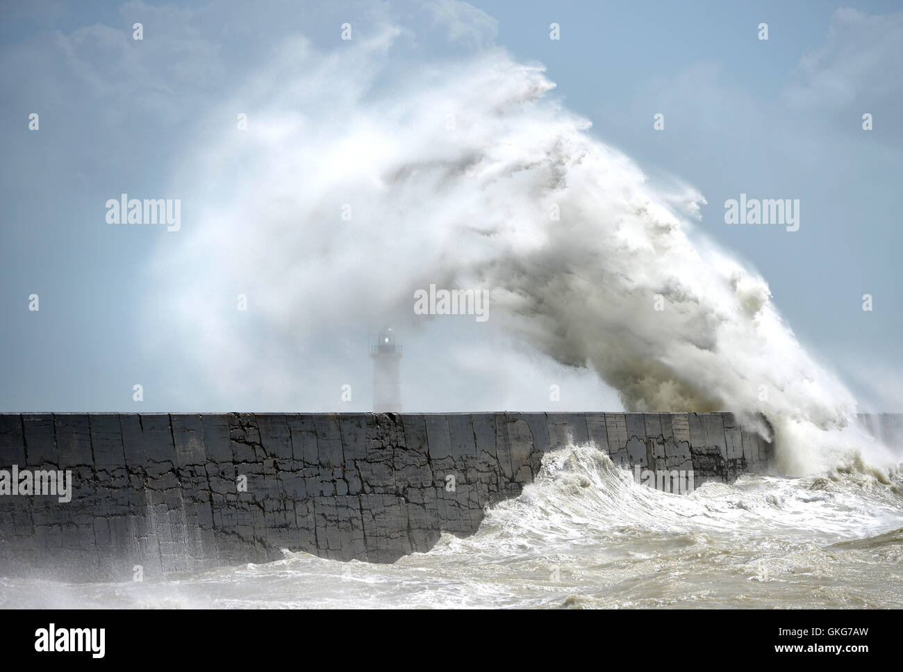 Huge waves hit Newhaven lighthouse, UK, during summer storms Stock Photo