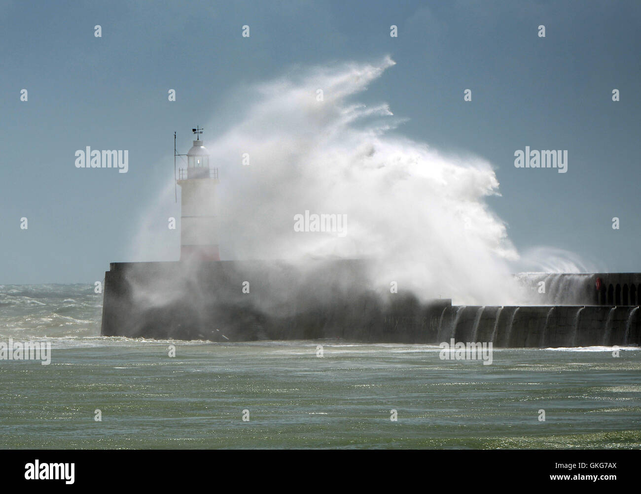 Huge waves hit Newhaven lighthouse, UK, during summer storms Stock Photo