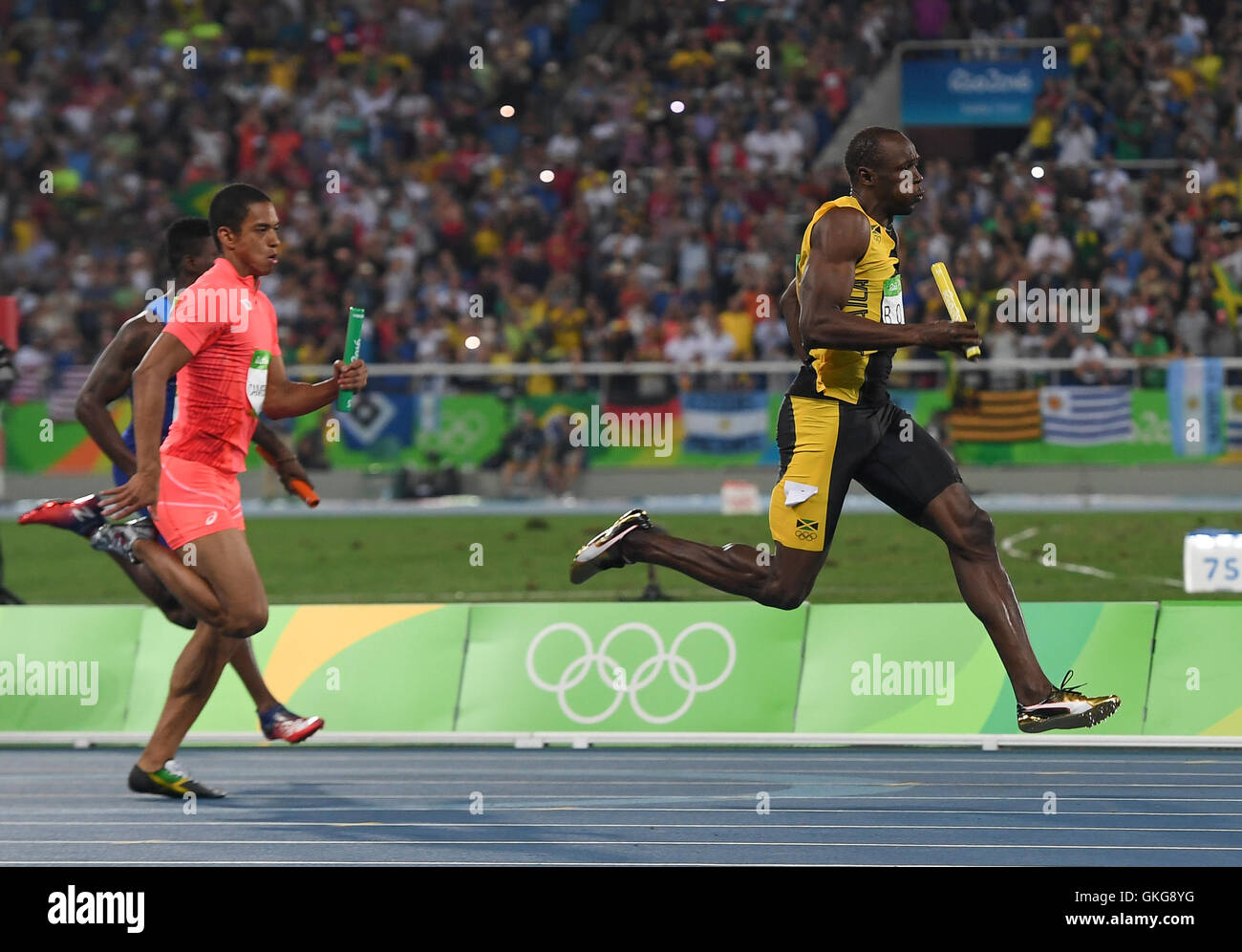 Rio de Janeiro, Brazil. 19th August, 2016. Usain Bolt of Jamaica actors his team home in the mens 4x100m relay final during the (EVENT) on Day 14 Athletics of the 2016 Rio Olympics at Olympic Stadium on August 19, 2016 in Rio de Janeiro, Brazil. Credit:  Roger Sedres/Alamy Live News Stock Photo