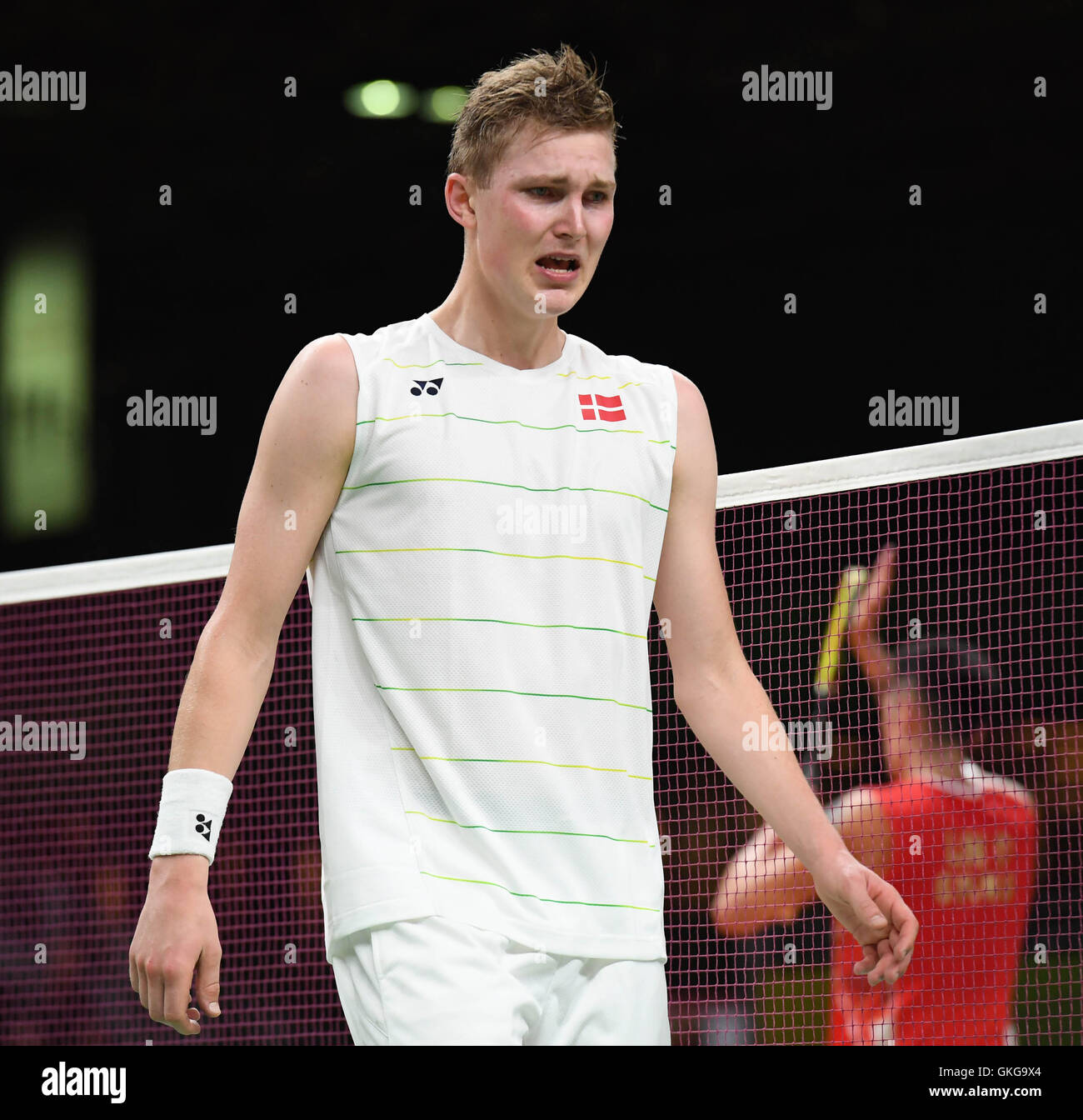 Rio De Janeiro, Brazil. 20th Aug, 2016. Denmark's Viktor Axelsen (L)  celebrates after the men's singles bronze medal match of badminton between  China's Lin Dan and Denmark's Viktor Axelsen at the 2016