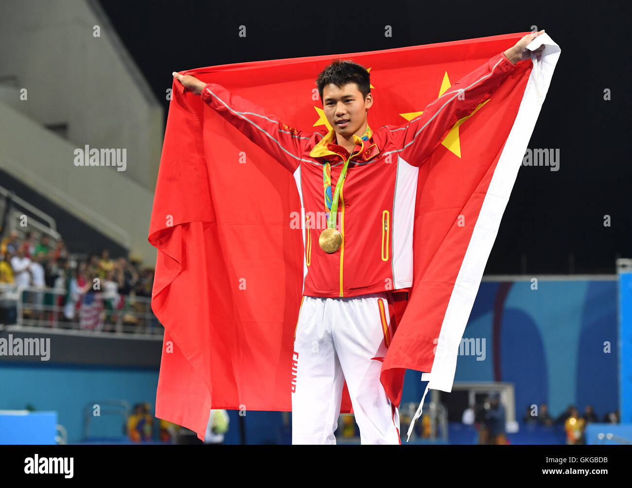 Rio de Janeiro, Brazil. 20th Aug, 2016. Gold medalist Chen Aisen of China celbrates during the medal ceremony of the Men's 10m Platform Final of the Diving event during the Rio 2016 Olympic Games at the Maria Lenk Aquatics Centre in Rio de Janeiro, Brazil, 20 August 2016. Photo: Felix Kaestle/dpa/Alamy Live News Stock Photo