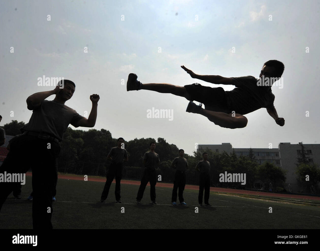 (160821) -- DEYANG, Aug. 21, 2016 (Xinhua) -- Trainees practise catching and grappling at the Guanghan Campus of China Aviation Flight University of China in Deyang, southwest China's Sichuan Province, Aug. 20, 2016. Aviation security officer, also known as flight security officer, is responsible for guarding safety of persons on board and plane on a civil aircraft. To become an aviation security officer is not an easy thing. After a preliminary training for two months and a half, applicants must have at least 100-hour training on real planes. Despite of rigid test, many Chinese young people c Stock Photo