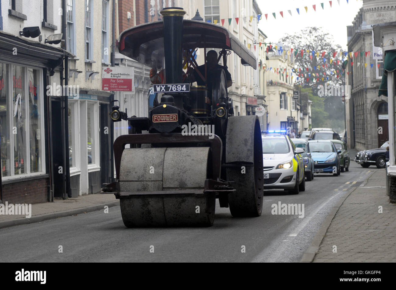 Kington, Herefordshire, UK. 21st August 2016.  A 1931 Fowler Steam Roller owned by Ian, Lewis and Tracey Mason from Hereford makes its way up Kington High Street. Credit:  Andrew Compton/Alamy Live News Stock Photo