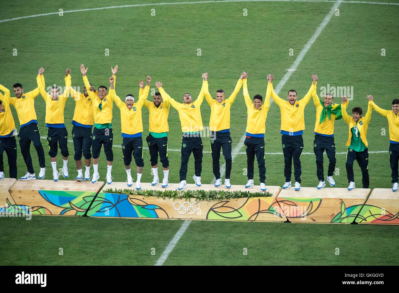 Rio de Janeiro, Brazil. 20th Aug, 2016. Brazil team group (BRA) Football/Soccer : Brazil players celebrate on the podium during the medal ceremony after the Rio 2016 Olympic Games Men's Football Final match between Brazil 1(5-4)1 Germany at Maracana in Rio de Janeiro, Brazil . Credit:  Enrico Calderoni/AFLO SPORT/Alamy Live News Stock Photo