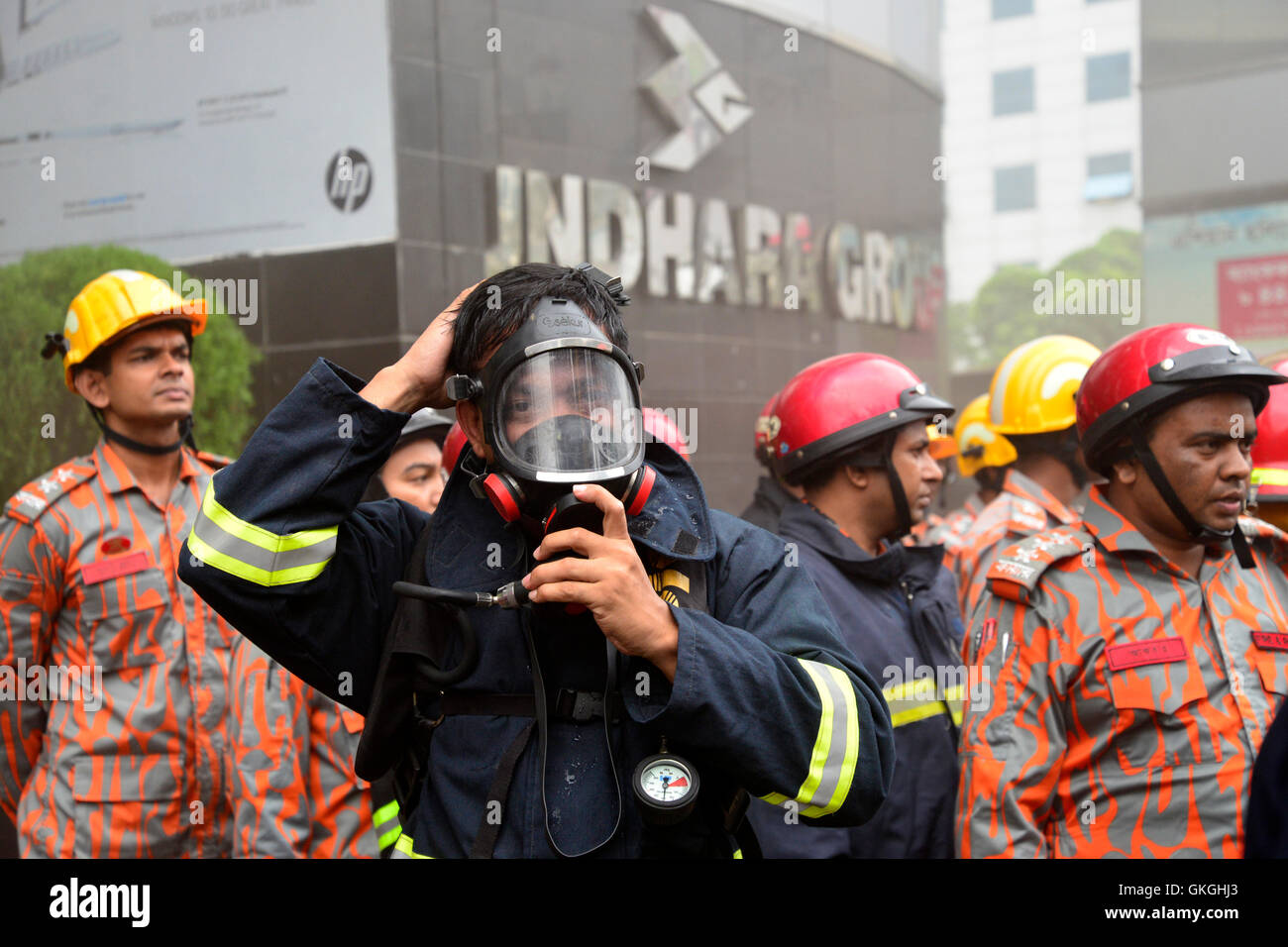 Bangladeshi firefighters work to douse a fire at the Bashundhara City