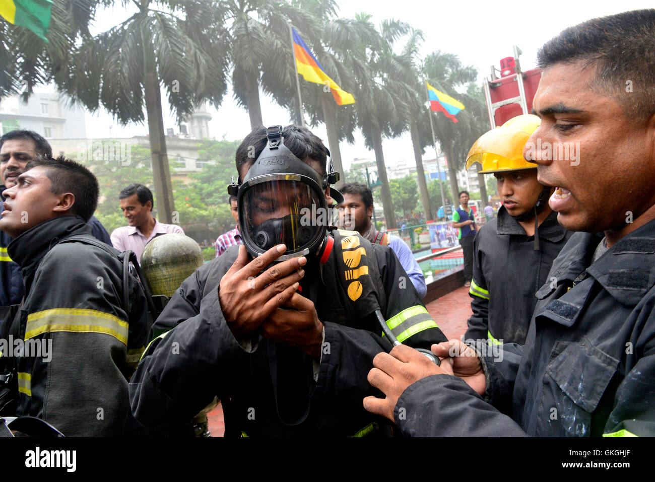 Bangladeshi firefighters work to douse a fire at the Bashundhara City ...
