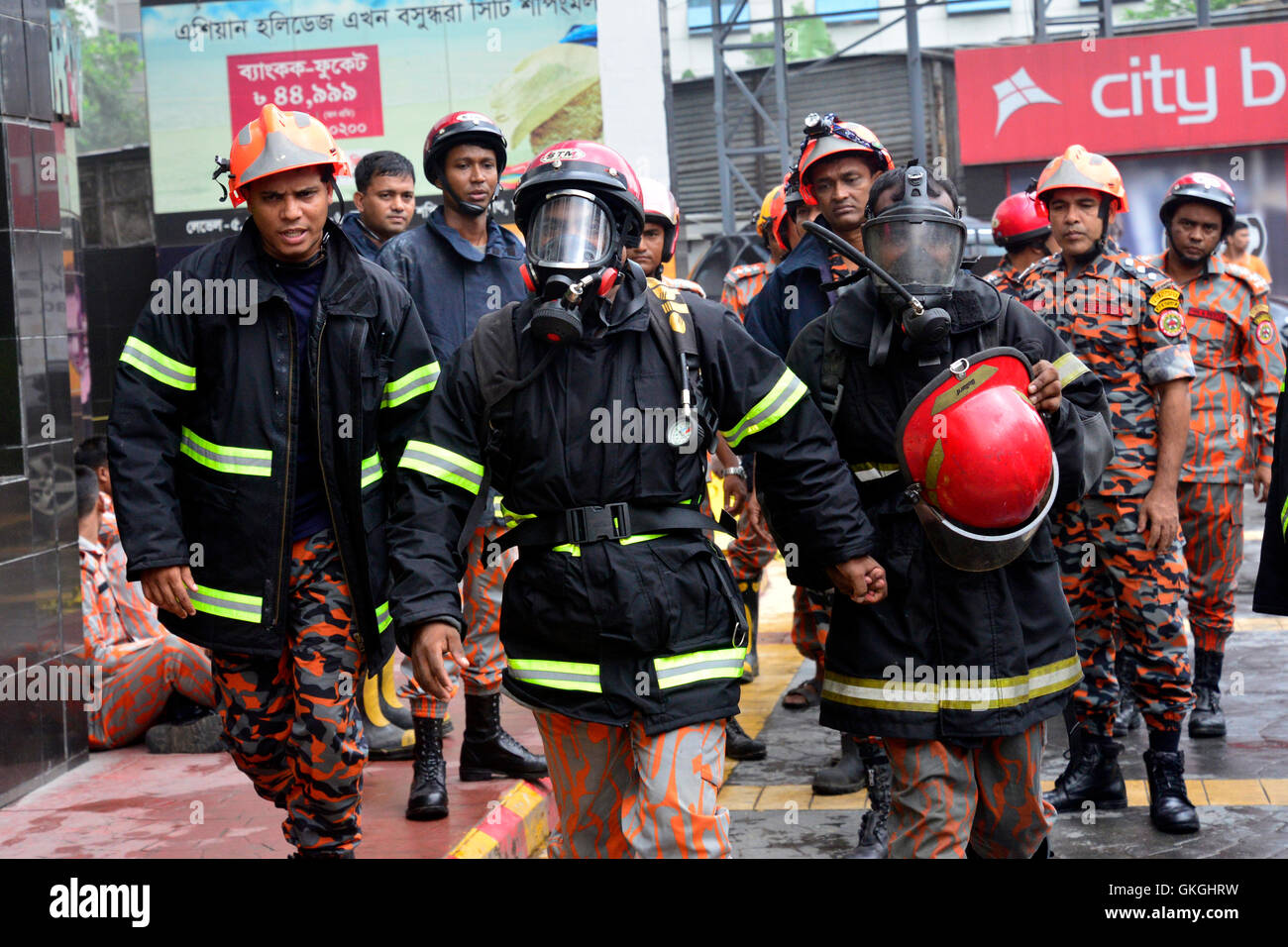 Bangladeshi firefighters work to douse a fire at the Bashundhara City ...