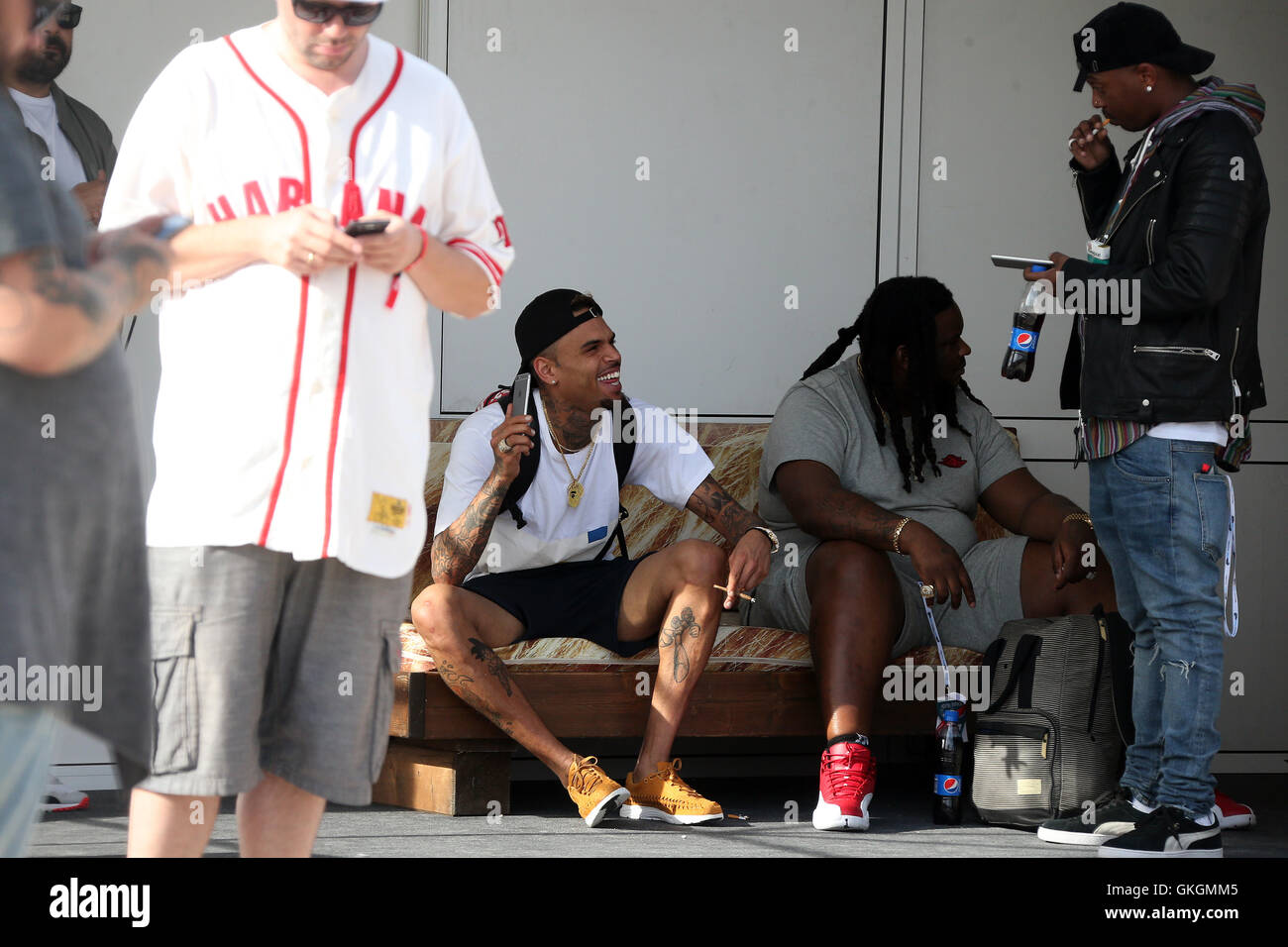 Chris brown plays mobile phone hi-res stock photography and images