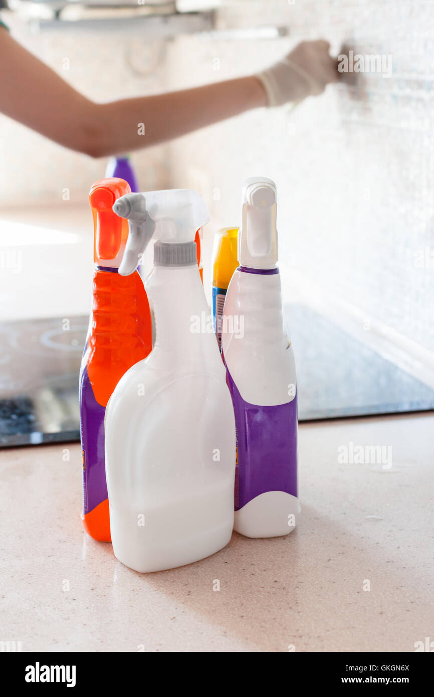 House cleaning - plastic bottles with detergents on kitchen tabletop Stock Photo