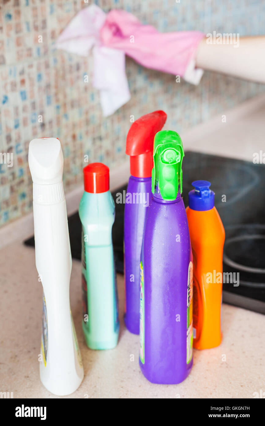 House cleaning - plastic bottles with detergents on kitchen worktop Stock Photo