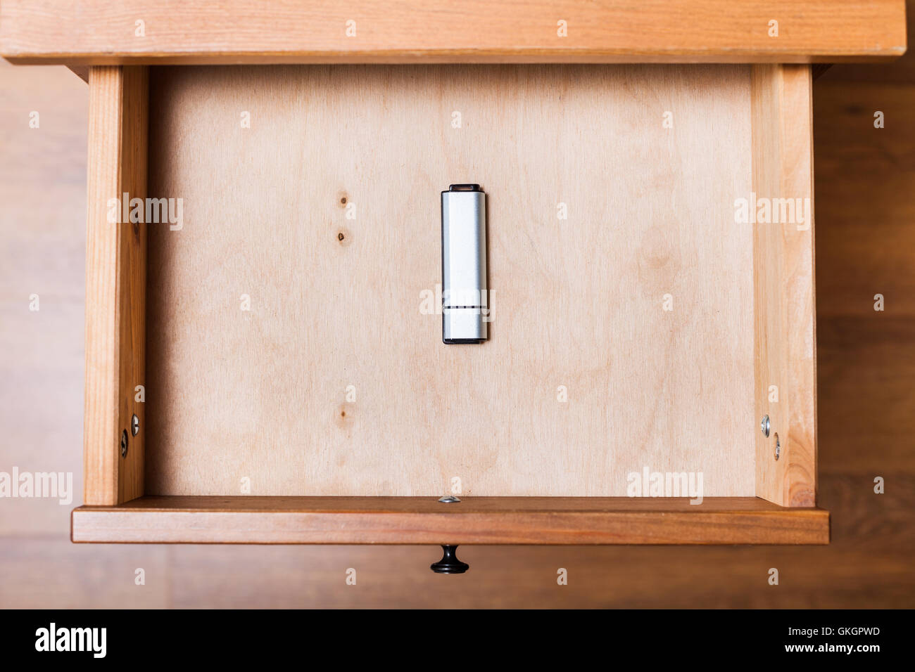top view of closed flash drive in open drawer of nightstand Stock Photo ...