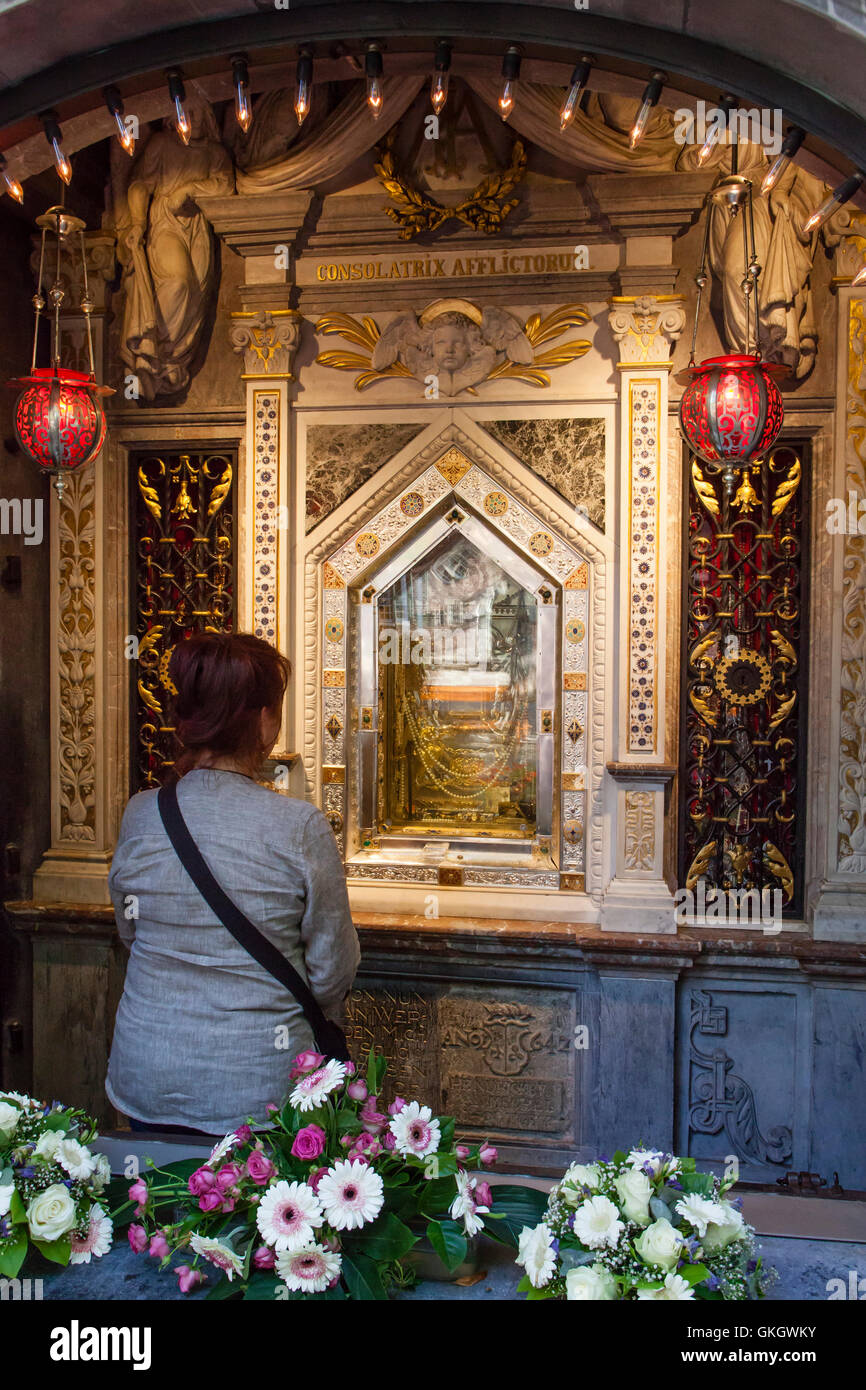 Germany, Kevelaer, woman contemplate the picture of Holy Mary, Full of Grace inside the Chapel of Grace Stock Photo