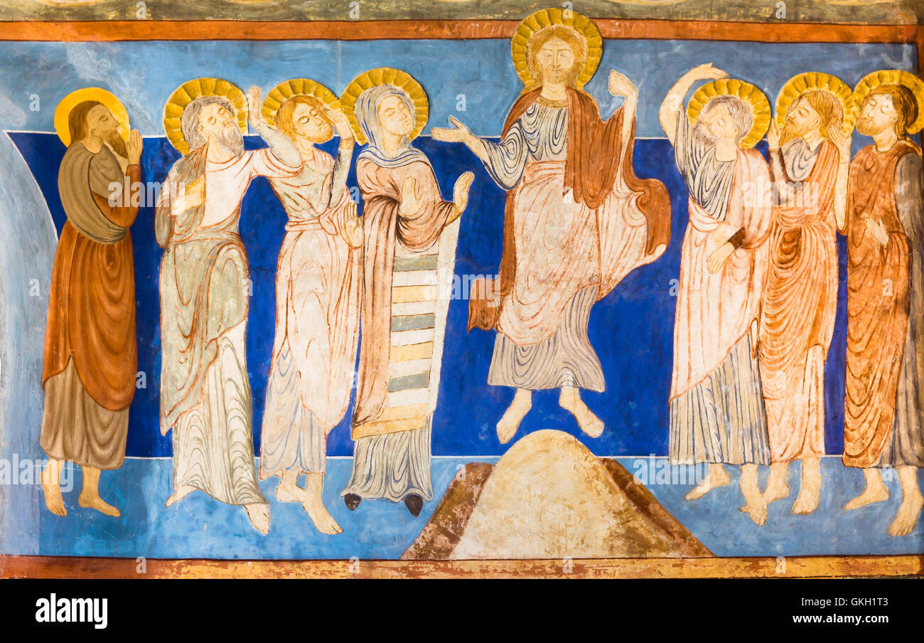 Ascension of Jesus, he ascends into heaven, the departure of Christ from Earth into the presence of God, a Romanesque fresco from the1100s Stock Photo