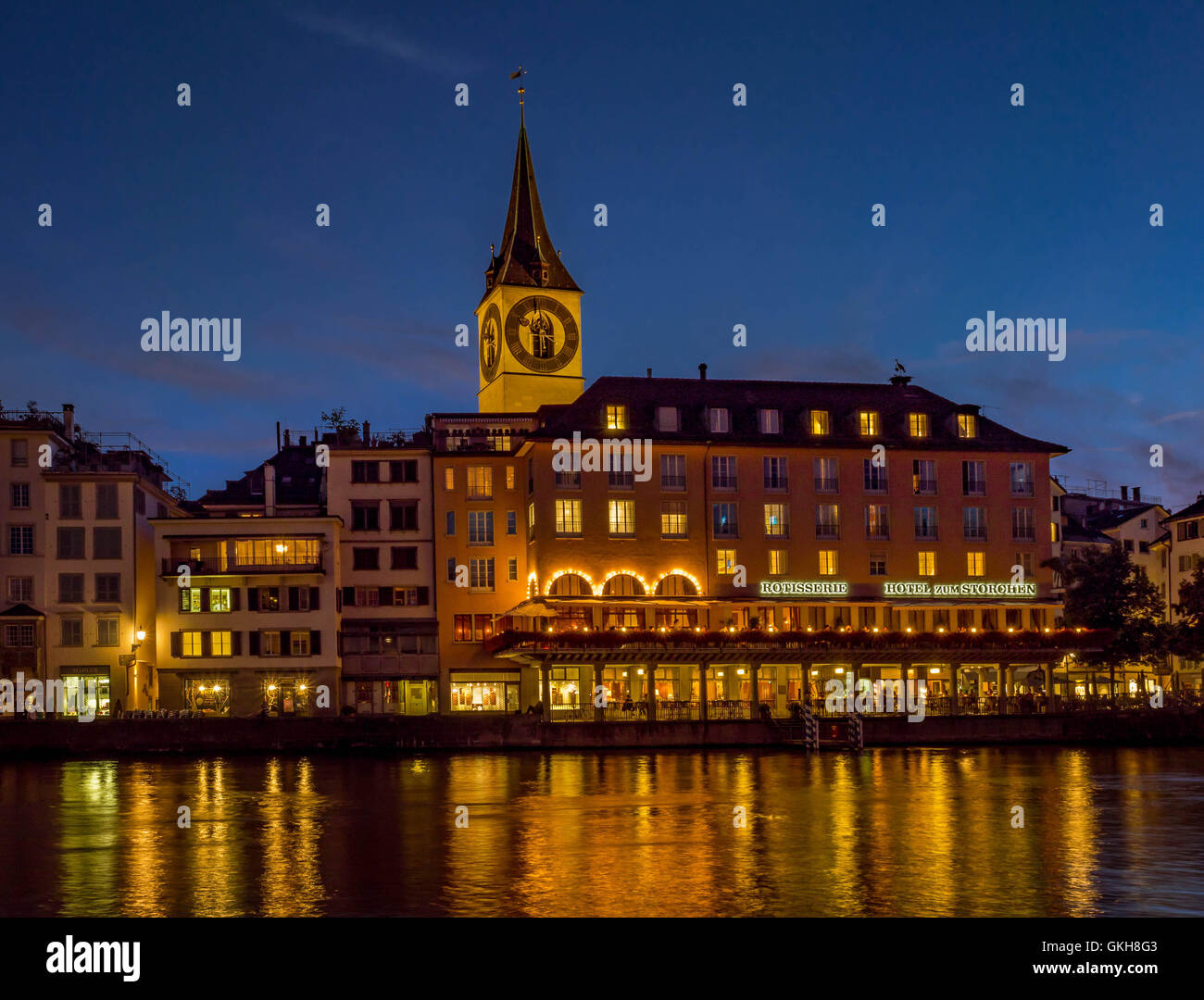 St. Peters Church and Hotel zum Storchen in Zurich at night, Switzerland, Europe. Stock Photo