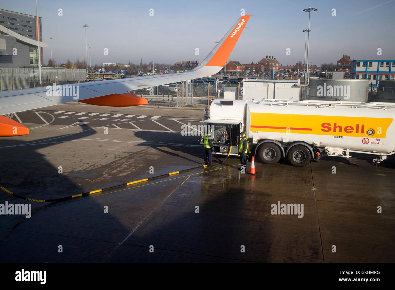 Shell oil jet-a1 refuelling tanker refuelling easyjet aircraft at liverpool john lennon airport in the uk Stock Photo