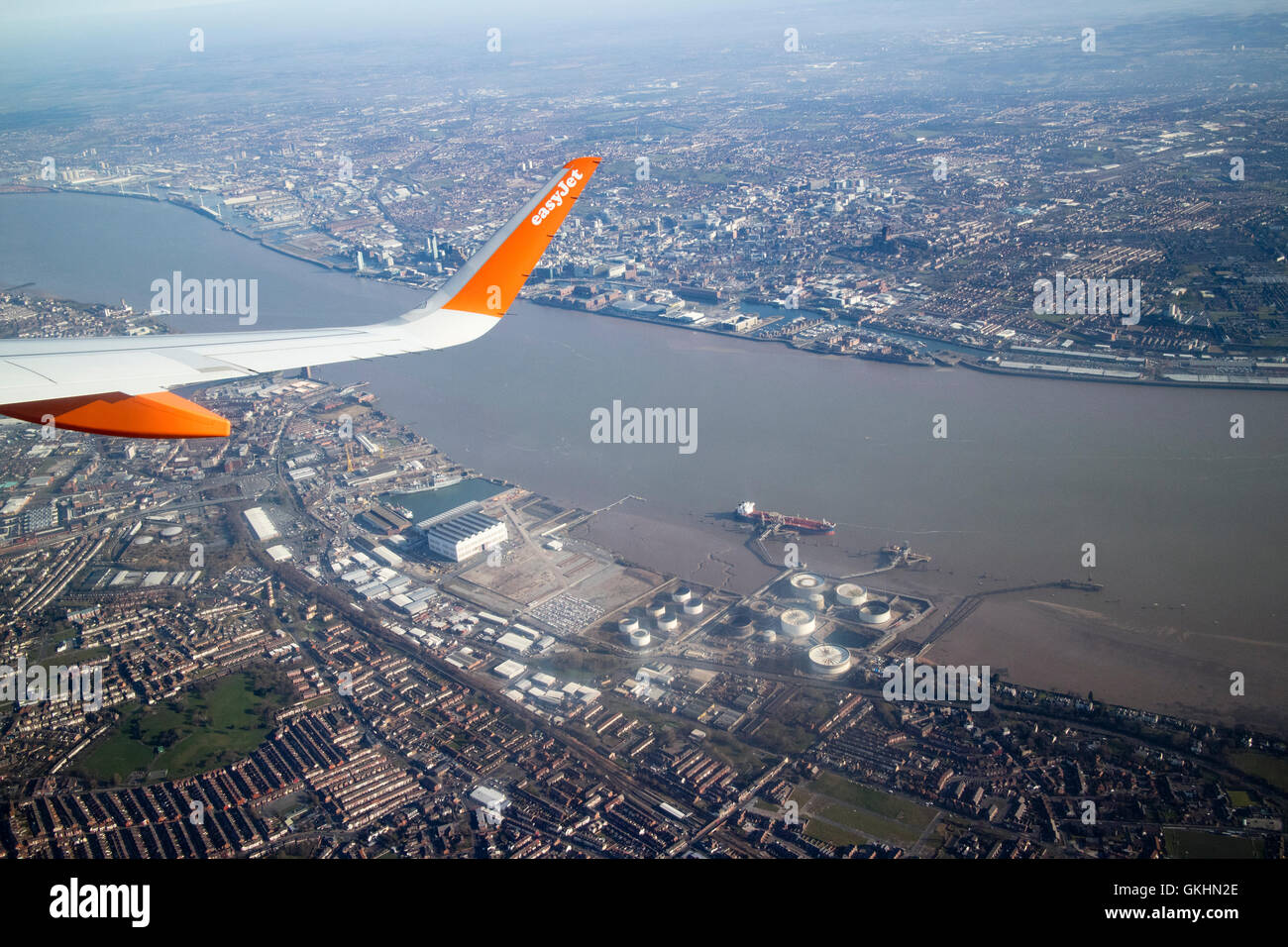 aerial view of easyjet aircraft flying over birkenhead docks, Liverpool and the river Mersey Stock Photo