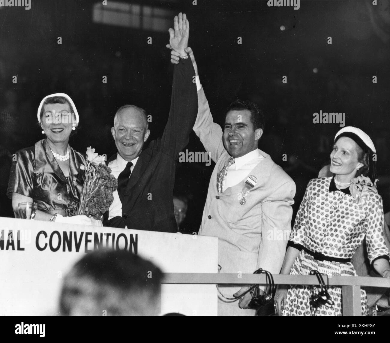 Republican nominee Gen. Dwight Eisenhower's arm is raised before delegates at concluding convention session in Chicago on July 11, by Ike's running mate on the GOP ticket, Richard M. Nixon of California. Stock Photo